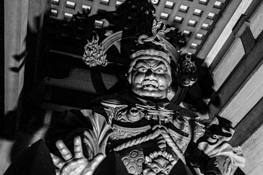 A black and white photo of a statue